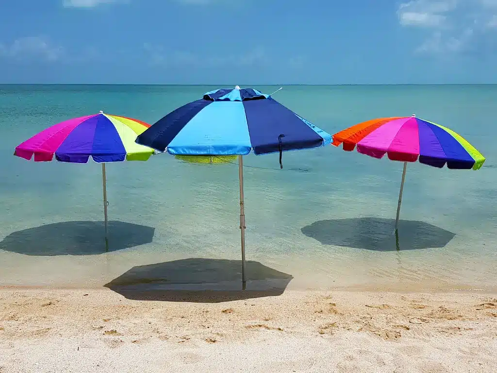 Colorful Beach Umbrellas on Calm Water