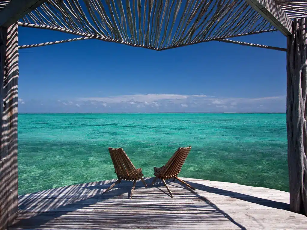 Chairs on a Dock Over Water in Belize