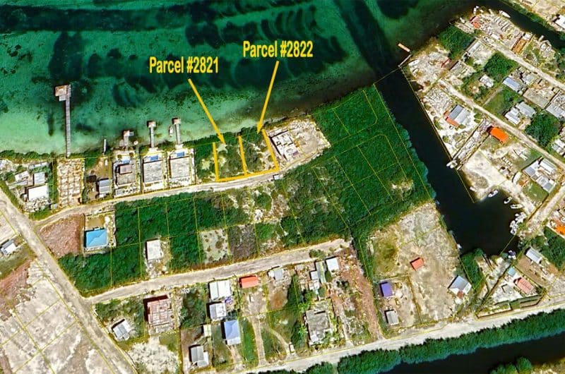 Aerial view of waterfront lots with sunset views on Ambergris Caye